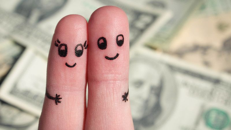 Finger art of Happy couple. Man and woman hug on background of money